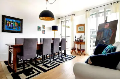 a living room with a dining room table and chairs at Appartamento Marissia in Rome