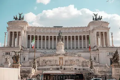 a large building with a bus in front of it at DolceVite - Fontana Di Trevi in Rome