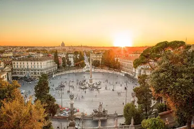 a view of a large plaza in a city at sunset at DolceVite - Fontana Di Trevi in Rome