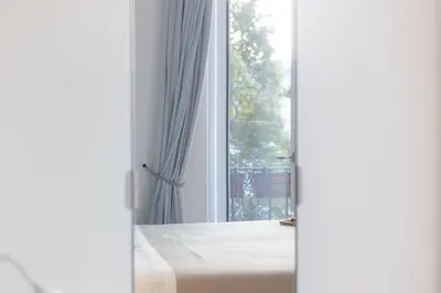 an open door to a room with a window at Colosseo Apartment holiday Venus Appartamento al Colosseo a Monti in Rome