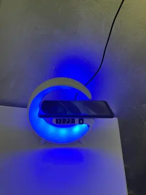 a remote control sitting on a table with a blue light at Rome's heart in Rome