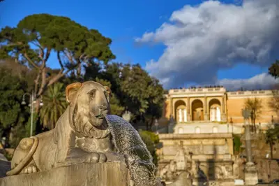 a statue of a lion sitting in front of a building at Rome's heart in Rome