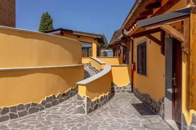 a cobblestone alley between two buildings at Il Piccolo Borghetto in Rome