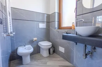 a bathroom with a toilet and a sink at Il Piccolo Borghetto in Rome
