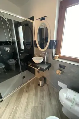 a bathroom with a sink and a mirror at Il Piccolo Borghetto in Rome