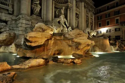 a view of the trevi fountain at night at Domus Merulana Bed and Breakfast in Rome