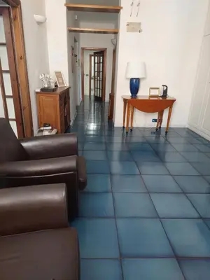 a living room with a couch and a table at Appartamento Delle Grazie in Rome