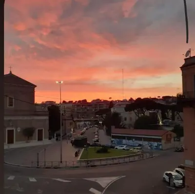a view of a city street at sunset at Appartamento Delle Grazie in Rome