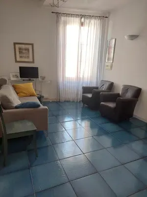 a living room with two couches and a tv at Appartamento Delle Grazie in Rome
