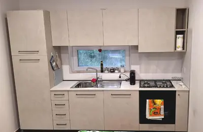 a small kitchen with a sink and a stove at San Paolo Hideout in Rome