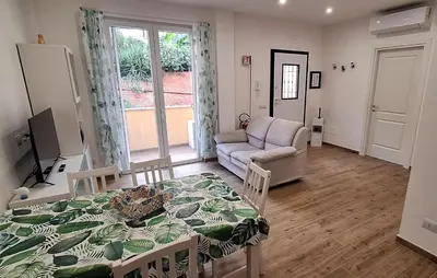 a living room with a table and a couch at San Paolo Hideout in Rome