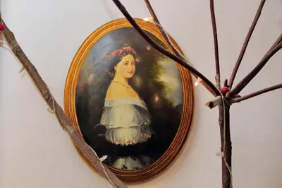 a framed painting of a woman in a white dress at Garden Corner Pigneto apartment Rome in Rome