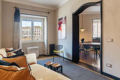 a living room with a couch and a table at Torre Argentina - Charme Holidays in Rome