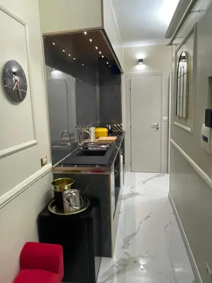 a kitchen with a sink and a red stool at The Madame Sofia - A Secret Hotel - Small Boutique Hotel & Apartments in Rome