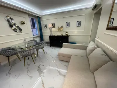 a living room with a couch and a table at The Madame Sofia - A Secret Hotel - Small Boutique Hotel & Apartments in Rome