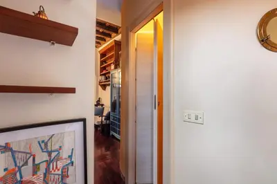 a hallway with a door leading into a room at Trastevere Enchanting Apartment in Rome