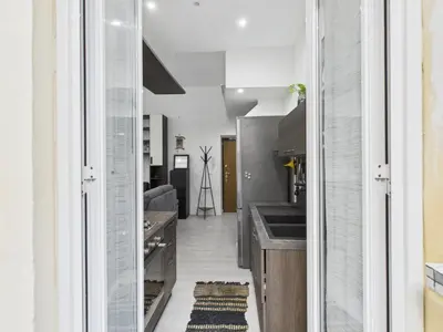 a kitchen with a sink and a counter at Esquilino Refined Holiday Home in the Heart of Rome in Rome