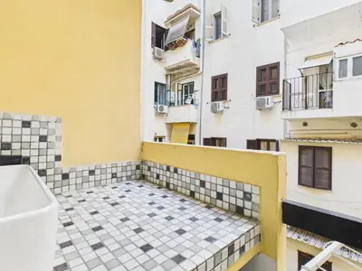 a balcony with a toilet on the side of a building at Esquilino Refined Holiday Home in the Heart of Rome in Rome
