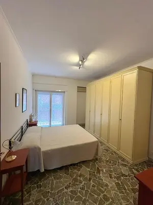 a bedroom with a large bed and a window at House of Tribuni - Near metro A in Rome