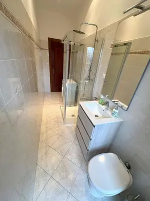 a bathroom with a toilet and a sink and a shower at House of Tribuni - Near metro A in Rome