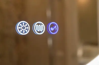 a close up of three logos on a glass door at Nox in Rome