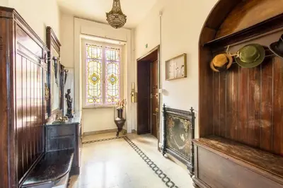 a hallway with a room with a door and a window at Trastevere Decò Apartment in Rome