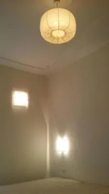 a room with two lights on the wall at Casa Rosy in Rome