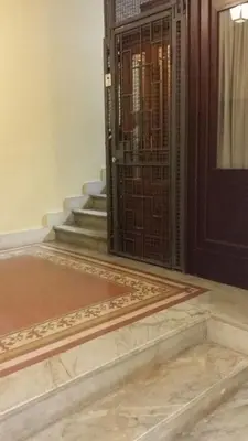 an entrance to a building with a door and stairs at Casa Rosy in Rome