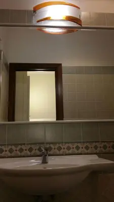 a bathroom with a sink and a mirror at Casa Rosy in Rome