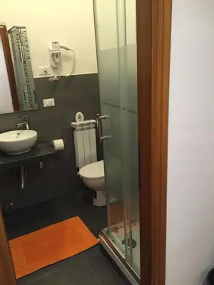 a bathroom with a toilet and a sink at B&B Isolatiberina in Rome