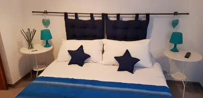 a bedroom with a bed with black and white pillows at B&B Isolatiberina in Rome