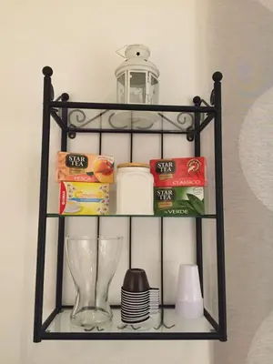 a black shelf with food and a blender on it at B&B Isolatiberina in Rome