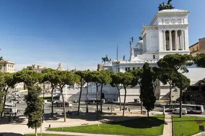 a view of a building with trees in front of it at Rome Downtown Suite Bed and Breakfast Aracoeli in Rome