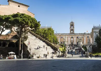 a group of people on stairs in front of a building at Rome Downtown Suite Bed and Breakfast Aracoeli in Rome