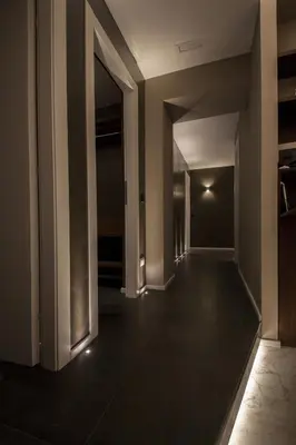 an empty hallway with a dark floor and white walls at NG Guest House Roma San Pietro in Rome