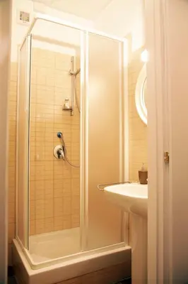 a bathroom with a shower and a sink at Casa Visconti in Rome