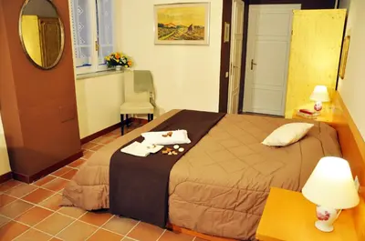 a bedroom with a bed with two towels on it at Casa Visconti in Rome