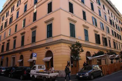 a large building with a truck parked in front of it at Pia Domus in Rome