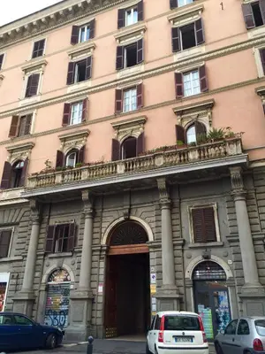 a large building with cars parked in front of it at Lin Mare in Rome