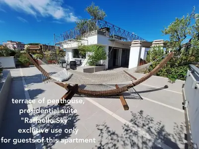 a hammock in front of a house at Delmirani's Book Apartments - Vatican View in Rome