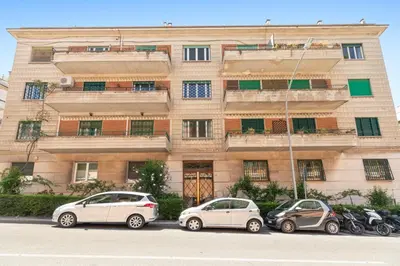 three cars parked in front of a building at Bright Family 5BR Apartment in Parioli in Rome