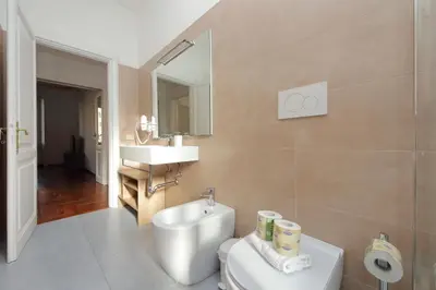 a bathroom with a toilet and a sink at 4BNB - St. Peters Dome Apartment in Rome