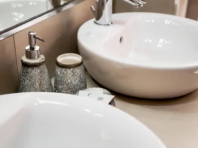 a bathroom with a white toilet and a sink at Saint Peter Welcoming Apartment in Rome
