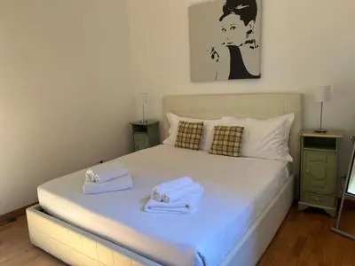 a bedroom with a bed with towels on it at San Vitale 18 by GHOR in Rome