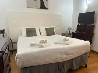 a bedroom with a large bed with towels on it at San Vitale 18 by GHOR in Rome