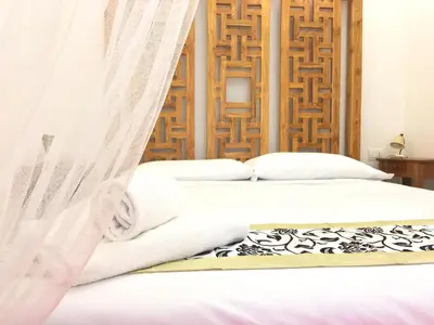 a bedroom with two beds with white sheets at CasaBlanca Apartment in Rome