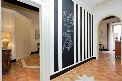 a hallway with black and white stripes on the wall at Bollo in Rome