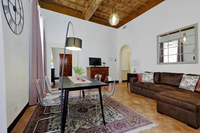 a living room with a table and a couch at Bollo in Rome