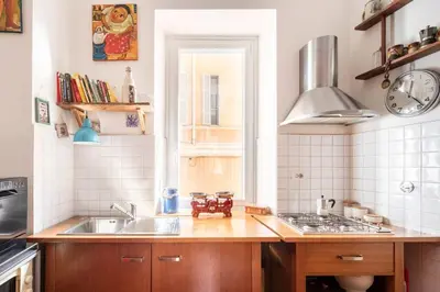 a kitchen with a sink and a stove at A Secret Corner in Rome