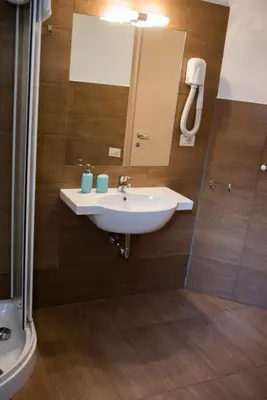 a bathroom with a sink and a mirror at Anna Guest House in Rome